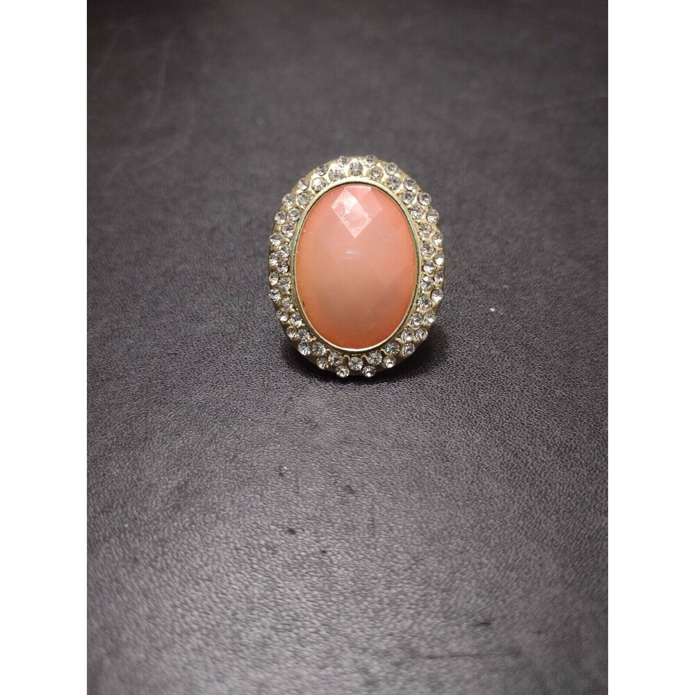 Gold tone ring with peach and clear rhinestones 8.75